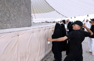 Pilgrims are pelting stone at Satan as a part of the Hajj procession