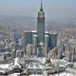 An aerial view of the Holy Kaaba and the Clock Tower in its premises, captured through a helicopter flight