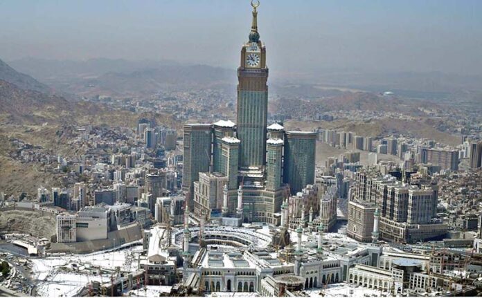 An aerial view of the Holy Kaaba and the Clock Tower in its premises, captured through a helicopter flight