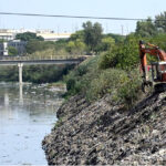 Worker busy cleaning garbage with the help of machine from ‘Nullah Lai’ before monsoon season