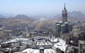 An aerial view of the Holy Kaaba and the Clock Tower in its premises, captured through a helicopter flight