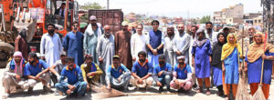 Chairman Rawalpindi Waste Management Company, Saqib Rafeeque in a group photo with the workers during the waste deposit operation on the eve of Eid ul Adha