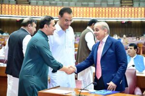 Prime Minister Muhammad Shehbaz Sharif interacts with parliamentarians during a session of the National Assembly.