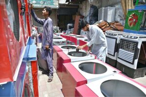 Workers are making room coolers at his Work Place as per increasing demand in summer season