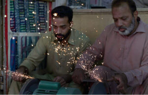 Blacksmiths are busy in sharpening knives to be used for slaughtering sacrificial animals ahead of Eid-ul Azha at Purana Qila