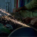 Blacksmiths are busy in sharpening knives to be used for slaughtering sacrificial animals ahead of Eid-ul Azha at Purana Qila