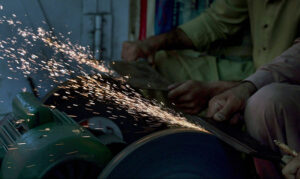 Blacksmiths are busy in sharpening knives to be used for slaughtering sacrificial animals ahead of Eid-ul Azha at Purana Qila