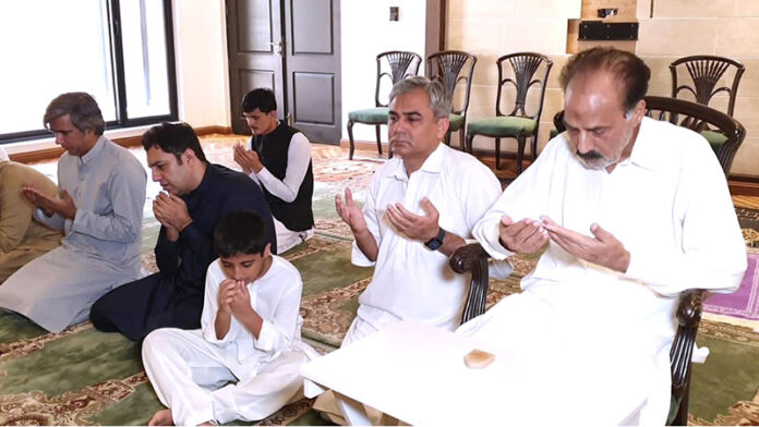 Federal Minister for Interior Mohsin Naqvi offering Dua after Eid prayer