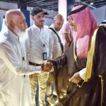 Saudi Minister of Information Salman Al-Dosari shaking hands with foreign journalists during a visit to the media hub established for Hajj 2024