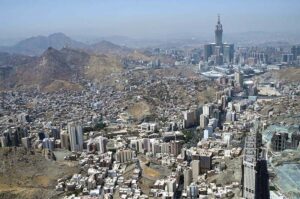 An aerial view of the Holy Kaaba and the Clock Tower in its premises, captured through a helicopter flight