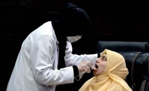 Dental surgeon examine patient at a free dental camp organized at APP headquarters.