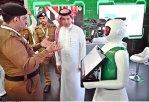 Saudi Minister of Information Salman Al-Dosari shaking hands with foreign journalists during a visit to the media hub established for Hajj 2024