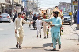 A vendor displaying and selling wooden pieces to be used for cutting meat of sacrificial animals during Eid-ul-Adha