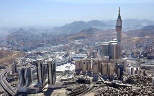 An aerial view of the Holy Kaaba and the Clock Tower in its premises, captured through a helicopter flight