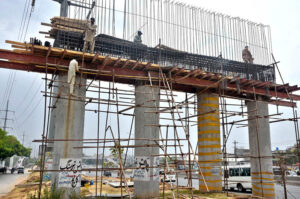 Labourers busy construction work of bridge in the Federal Capital.