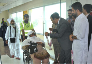 Director Hajj, Rehan Khokhar receiving pilgrims after the first post-Hajj flight landed at Multan Airport