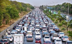 A view of a massive traffic jam clogs the Islamabad Expressway, with a seemingly endless queues of cars, buses, and motorcycles stretching as far as the eye can see