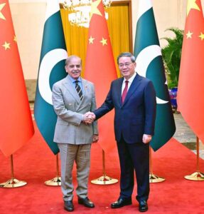 Prime Minister Muhammad Shehbaz Sharif shakes hands with his Chinese counterpart H.E. Li Qiang upon his arrival at Great Hall of the People.