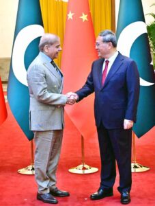 Prime Minister Muhammad Shehbaz Sharif shakes hands with his Chinese counterpart H.E. Li Qiang upon his arrival at Great Hall of the People.