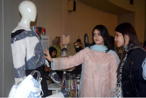 Visitors viewing the displayed items during the Art and Design exhibition