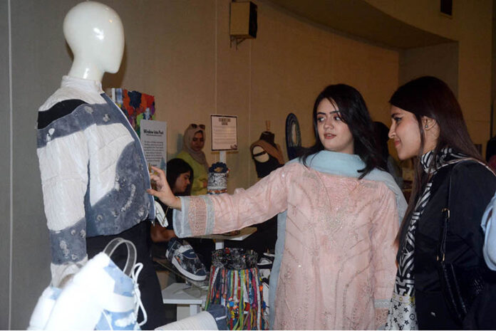 Visitors viewing the displayed items during the Art and Design exhibition
