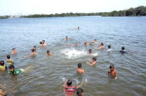 People finding relief in the water as the city's temperature rises at Native Jetty.