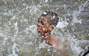 People finding relief in the water as the city's temperature rises at Native Jetty.