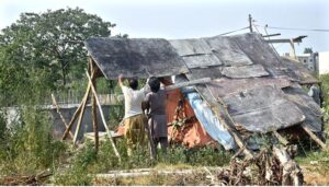 Gypsy men making makeshift home at roadside in the Federal Capital