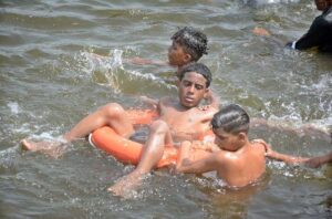 People finding relief in the water as the city's temperature rises at Native Jetty.