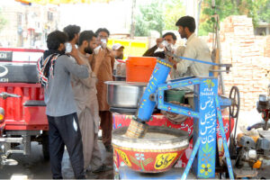 People quenching their thirst with the traditional summer drink (Ghota) during hot weather in the city