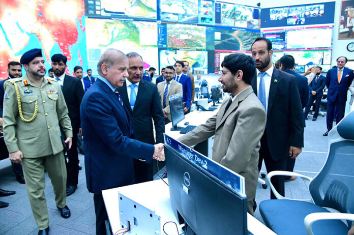Prime Minister Muhammad Shehbaz Sharif meets the staff of the National Emergencies Operation Centre