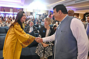 Federal Minister for States & Frontier Regions (SAFRON), Kashmir Affairs and Gilgit-Baltistan Engineer Amir Muqam addressing a seminar on "World Refugee Day-2024" organized by UNHCR.