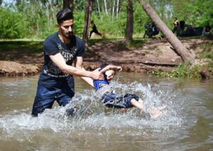 A youngster enjoy playing with child in a local stream to get some relief from hot weather in the Provincial Capital.