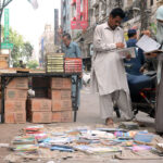 People selecting used books at Reagal Chowk
