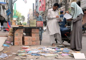 People selecting used books at Reagal Chowk