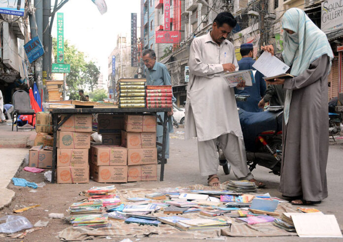 People selecting used books at Reagal Chowk