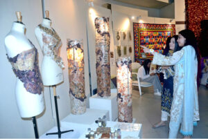 Visitors viewing the displayed items during the Art and Design exhibition (Degree Show 2024) at Johar Town