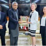 Federal Minister for Interior Mohsin Naqvi presenting souvenir to Canadian High Commissioner Leslie Scanlon