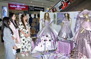 Visitors viewing the displayed Art and Design exhibition (4th Fashion Thesis) at Lyallpur Galleria organized by Government College Women University Faisalabad (GCWUF)