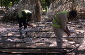 Parks & Horticulture Authority (PHA) workers craft light stands to illuminate the city, enhancing its charm and safety