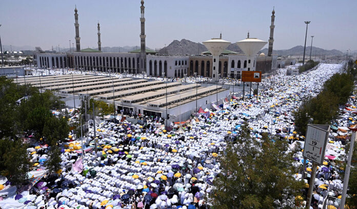 Pilgrims are performing the Zohr prayer in Arafat field on the occasion of Hajj 2024