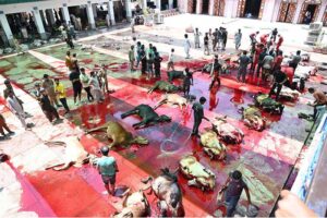 Butchers busy in slaughtering sacrificial animals at Jamia Naeemia on the first day of Eidul Azha