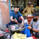 Vendor preparing Mincemeat of the sacrificial animal on the second day of Eidul Adha festive