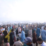 A large number of people enjoying at the beach on the third day of Eidul Azha