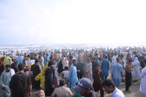 A large number of people enjoying at the beach on the third day of Eidul Azha