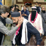 Director Hajj Punjab Muhammad Rizwan Sharif, Deputy Director Hajj Lahore Mujeeb Shah and others welcoming Hajaj Ikram and garlanding them with flowers