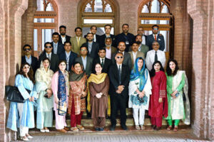 Delegation headed by Chief Instructor Ms Samina Intizar and Director Fouz Khalid Khan of National Institute of Management Karachi in a group photo with officers of the 40th Mid-Career Management Course of the National Institute of Management during their visit to Aitcheson College.