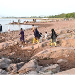 Visitors enjoy boat riding at Rawal Dam in the Federal Capital