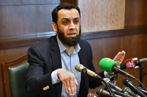 Federal Minister for Information and Broadcasting, Attaullah Tarar talking to media persons during press conference.