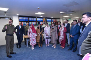 Officers of the 40th Mid-Career Management Course of the National Institute of Management headed by Chief Instructor Ms Samina Intizar and Director Fouz Khalid Khan attending a meeting during their visit to the Safe City Project.